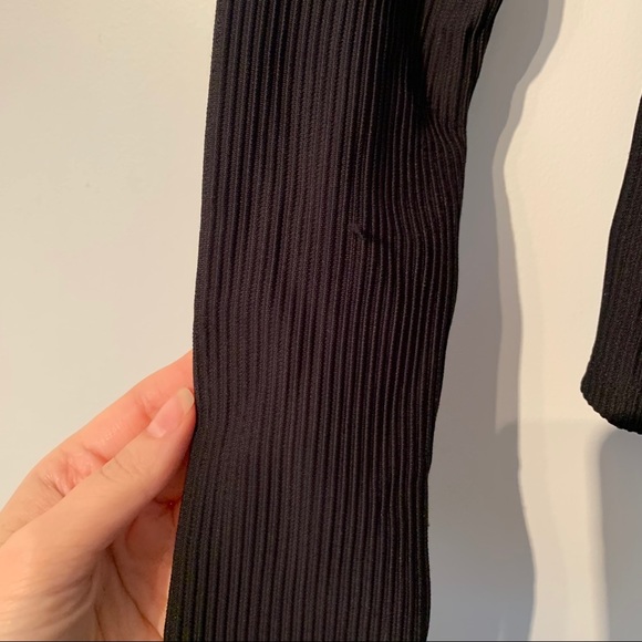 Black off the shoulder top with ruffled neckline. - Picture 2 of 4